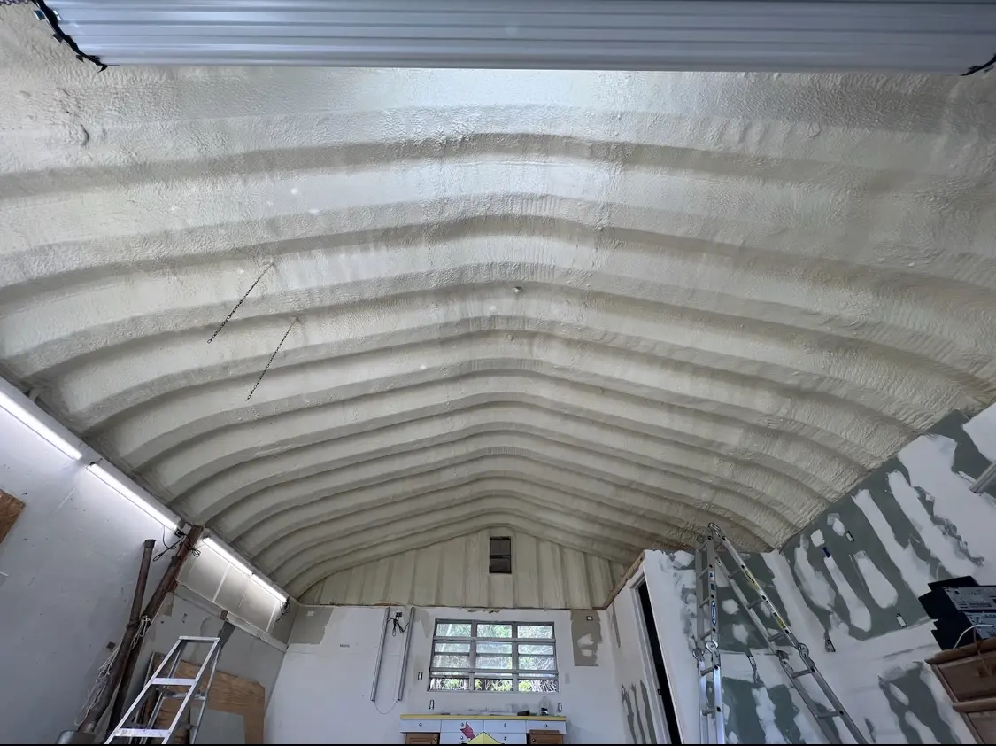 Spray polyurethane foam applied to the underside of a metal roof deck in Huntsville